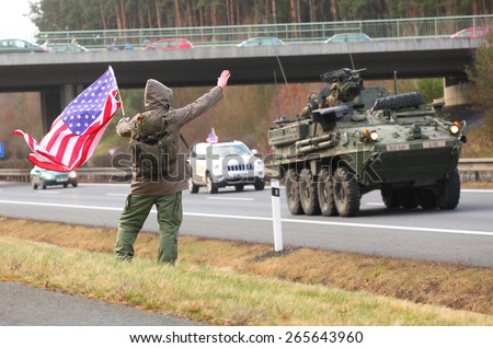 PILSEN CZECH REPUBLIC - APRIL 1, 2015:  Unidentified Czech citizens cheering up Dragoon Ride convoy from Operation Atlantic Resolve. Longest march US Army in Europe after second world war.