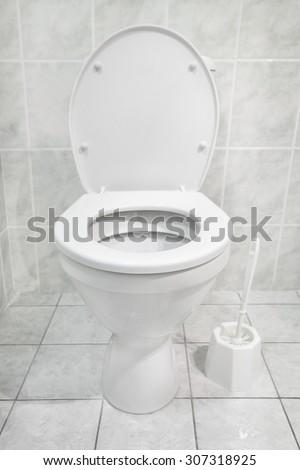 White toilet bowl in a modern bathroom. Hygiene concept.