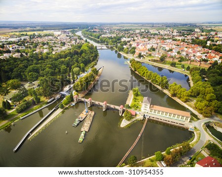 Hydroelectric plant on Elbe (Labe) River in Nymburk. Aerial view to industrial landscape with river in Czech Republic, Central Europe.