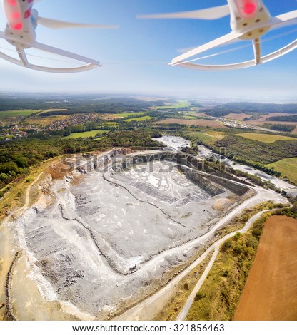 Aerial view to opencast mine. Use drones to inspect of mining area. Modern technology theme.
