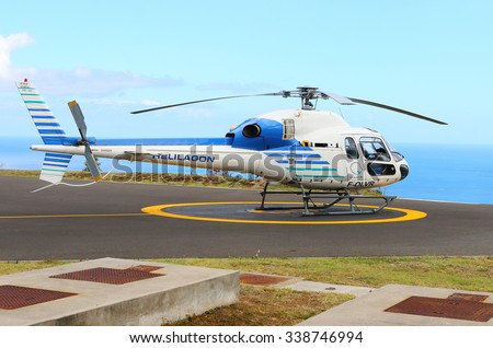 EPERON, REUNION ISLAND, FRANCE - NOVEMBER 7, 2015: The Eurocopter 355N double turbines on a Helilagon heliport. Helicopter for 6 passengers, max. weight: 2540 kg, max. speed: 278km/h