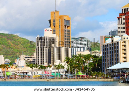 PORT LOUIS, MAURITIUS ISLAND - OCTOBER 30, 2015: Port Louis harbor with skyscrapers on city skyline on Mauritius Island.