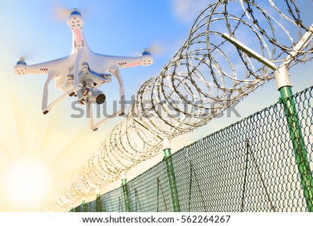 Drone monitoring barbed wire fence on state border or restricted area. Modern technology for security. Digital artwork on industrial theme.