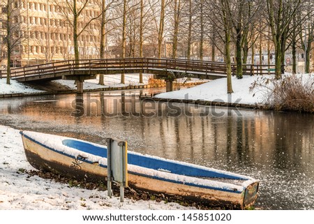 Winter sunny day in Netherlands with the view if a river and boat