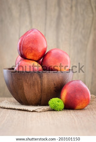 Juicy fresh peaches on  wooden background