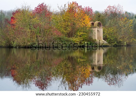 Colorful autumn trees reflected in water