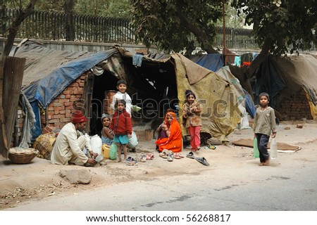 DELHI,INDIA - DECEMBER 12: Poor family at slum area December 12, 2008 in Delhi,India. Millions people of India doesn\'t have normal housing because of overcrowding problem