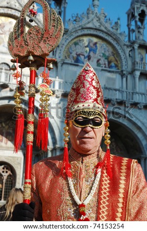 VENICE - MARCH 8: Man in costume at St. Mark\'s Square during the Carnival of Venice on March 8, 2011.The annual carnival was held in 2011 from February 26th to March 8th.