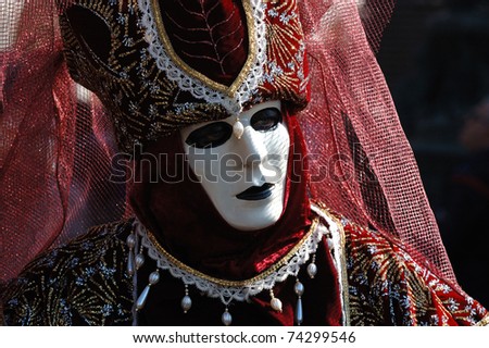 VENICE, ITALY - MARCH 8: Unidentified woman in costume attends the Carnival of Venice in St. Mark\'s Square on March 8, 2011 in Venice, Italy. The annual carnival was held from February 26March 8, 2011.