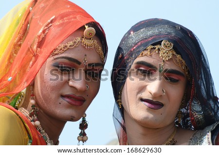 PUSHKAR, INDIA - NOVEMBER 12:Unidentified men (hijras) attend Pushkar camel fair on November 12,2013 in Pushkar,India.In Asia ,hijras are people who have feminine gender identity,so called third sex