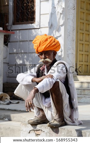 PUSHKAR, INDIA - NOVEMBER 14: Unidentified old man with traditional rajput headdress - turban at Pushkar camel fair on November 14, 2013 in Pushkar, Rajasthan, India.