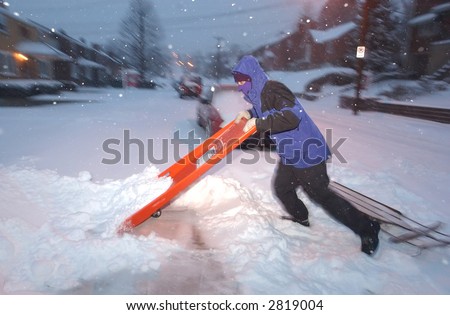 Shoveling snow from a sidewalk