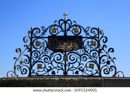 Saint John of Nepomuk, iron forged grid on Charles bridge, Prague