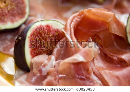 Cold snack. Prosciutto with fig fruit