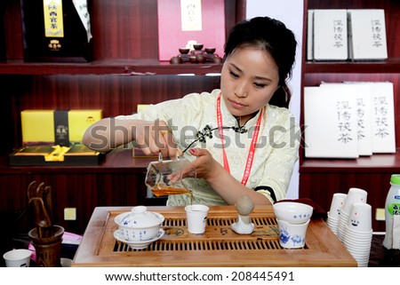 On June 7, 2014, xian, China, a professional woman are performing Chinese tea art and tea culture to the tourists.