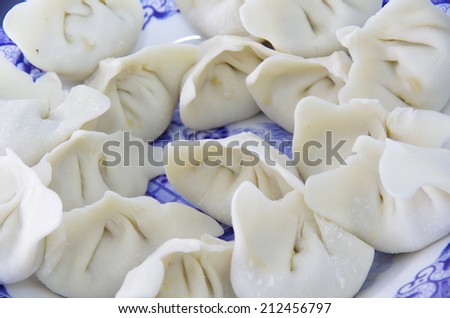 The tip of the tongue on the Chinese food, dumplings.