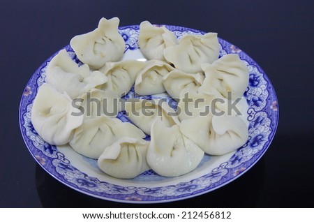 The tip of the tongue on the Chinese food, dumplings.