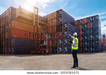 Foreman control loading Containers box from Cargo freight ship for import export, foreman control Industrial Container Cargo freight ship