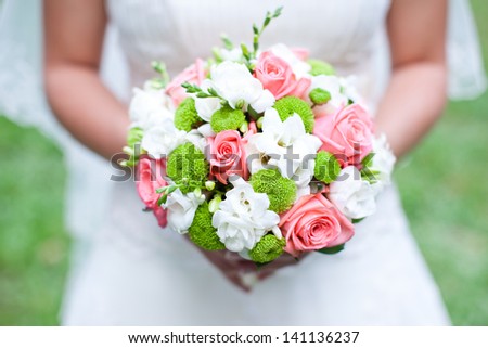 Beautiful bouquet in hands of the bride