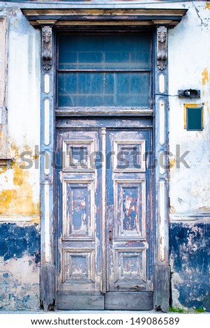 Very old wooden door painted in blue