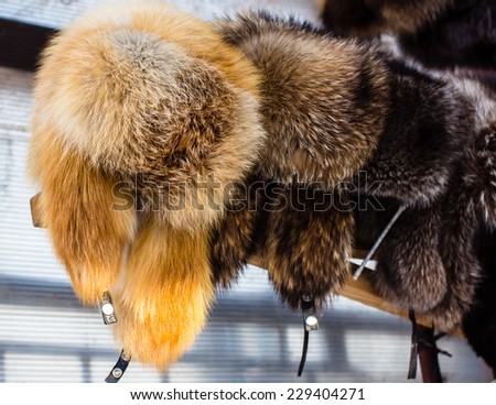 Market in Siberia, Russia: fur caps. Selective focus
