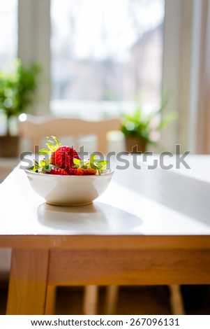 fresh strawberries on a kitchen table. Selective focus