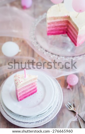 Pink and white birthday cake. Selective focus. Top view.