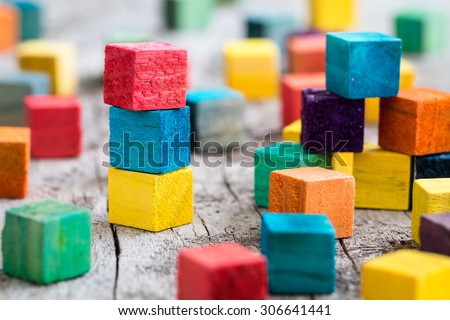 Colorful wooden building blocks. Selective focus