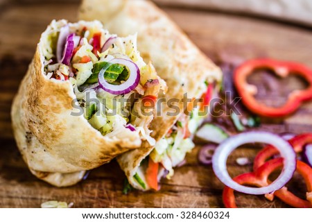 delicious vegan wrap filled with fresh vegetables. Selective focus