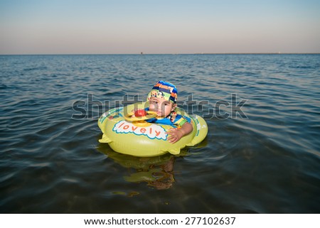 Asian baby on sea