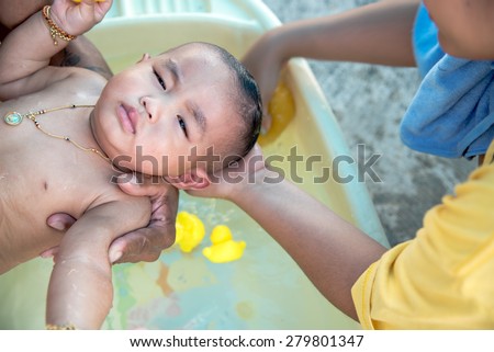 Asian baby take a bath