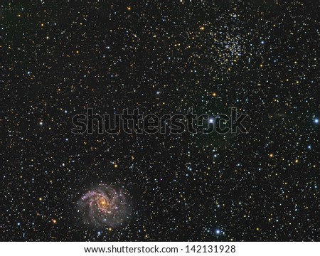 The Fireworks Galaxy and Open Cluster NGC6939 - A spiral galaxy and open cluster of stars about 23 million light years away in the constellation Capheus