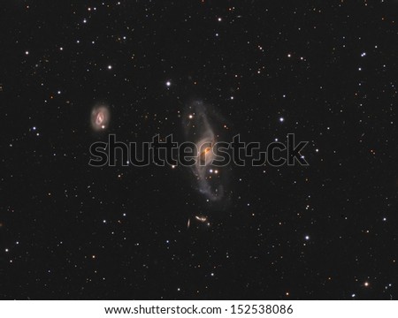 Spiral Galaxies NGC3718 and NGC3729: A pair of spiral galaxies about 53 million light years away in the constellation Ursa Major.