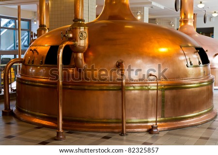 copper distillery tanks in brewery