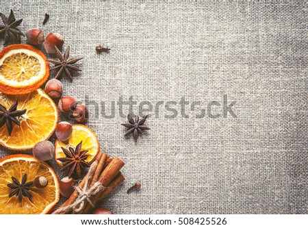 Christmas decoration with ,star anise,cinnamon stick,nuts and slices of dried oranges.
