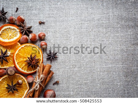 Christmas decoration with ,star anise,cinnamon stick,nuts and slices of dried oranges.