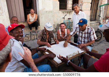 CAMAGUEY, CUBA - MARCH 11: Unidentified man play dominos on the street on March 11, 2011 in Camaguey, Cuba. Domino is one of the most popular games in Cuba