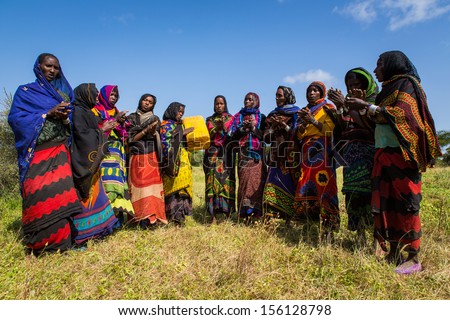 GAYO VILLAGE, ETHIOPIA - JUNE 20: Unidentified group of women perform a traditional song on June 20, 2012 in Gayo village, Ethiopia. The song says thanks for the cattle and water
