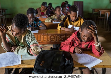 GAYO VILLAGE, ETHIOPIA - JUNE 20: Unidentified school boys take an exam in the village school on June 20, 2012 in Gayo village, Ethiopia.