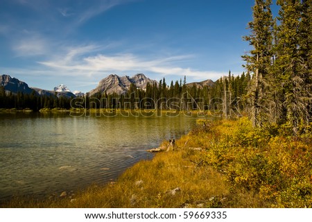 A small lake on the Smith Dorrien Spray Trail in Kananaskis, Western Alberta Canada, on a September afternoon.