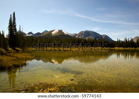 A small lake on the Smith Dorrien Spray Trail in Kananaskis, Western Alberta Canada, on a September afternoon.