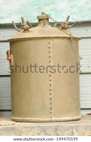 Old rusty pressure cooker in warehouse.