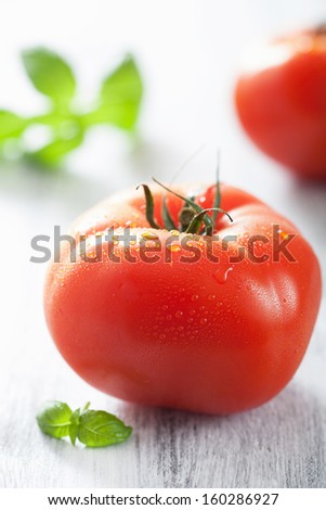 fresh big tomatoes and basil leaves