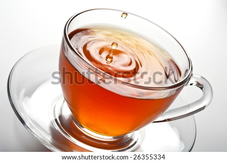 tea splash in glass cup