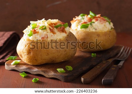 baked potato in jacket with bacon and cheese
