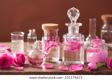 alchemy and aromatherapy set with rose flowers and flasks alchemy and aromatherapy set with rose flowers and flasks