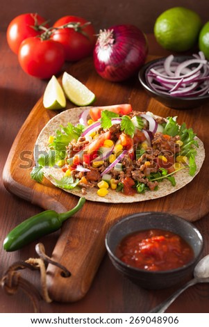 mexican taco with beef tomato salsa onion corn