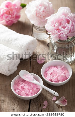 spa set with peony flowers and pink herbal salt