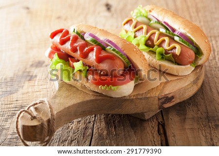 hotdog with ketchup mustard and vegetables