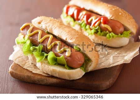 hot dog with ketchup mustard and vegetables